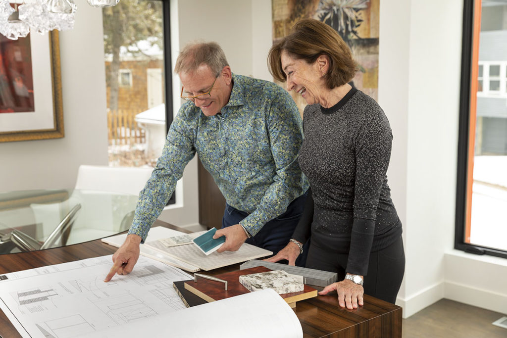 Randy and Susan looking at blueprints