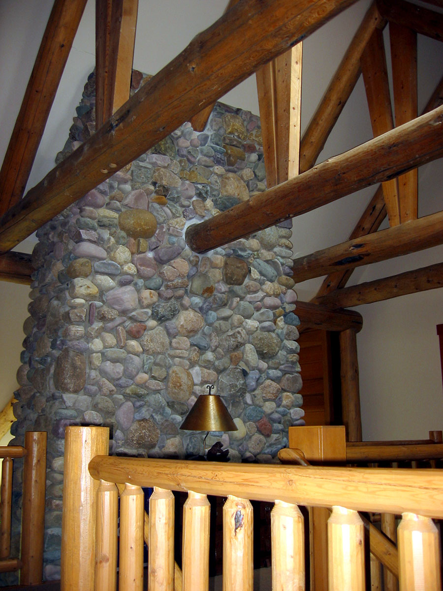 wooden support beams and rock chimney