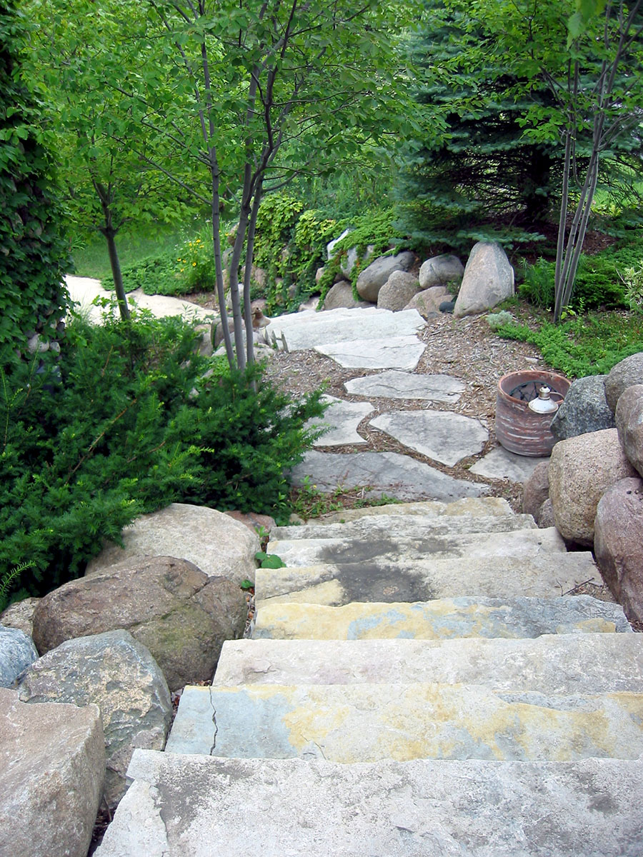 stone steps leading to a pond